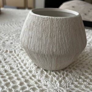 Small white ceramic vase